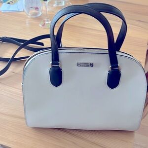Kate Spade purse, short handles, shoulder strap. 3 interior pockets, 1 exterior